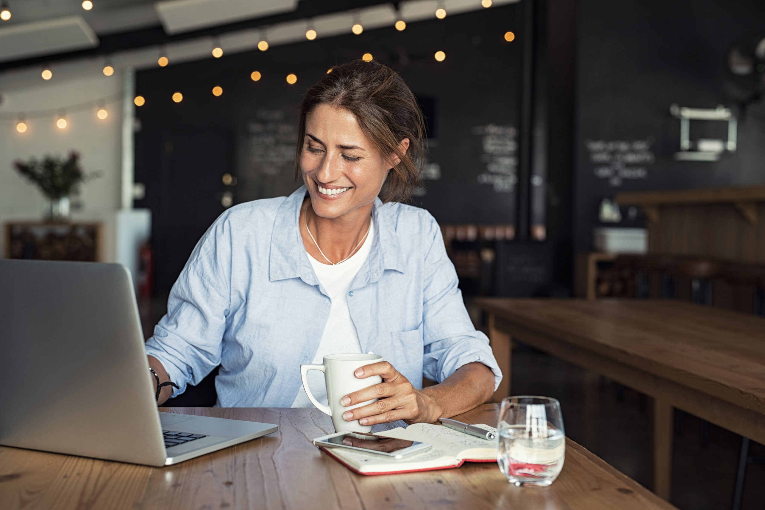 Mature woman working on laptop Flexibility and freedom of online business in 2025.